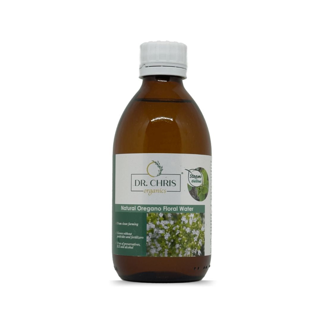 Product image of Oregano Floral Water by Dr. Chris Organics, 250 ml. A clear glass bottle with a minimalist label, featuring natural oregano illustrations. The product is organic and designed for soothing and refreshing skincare.